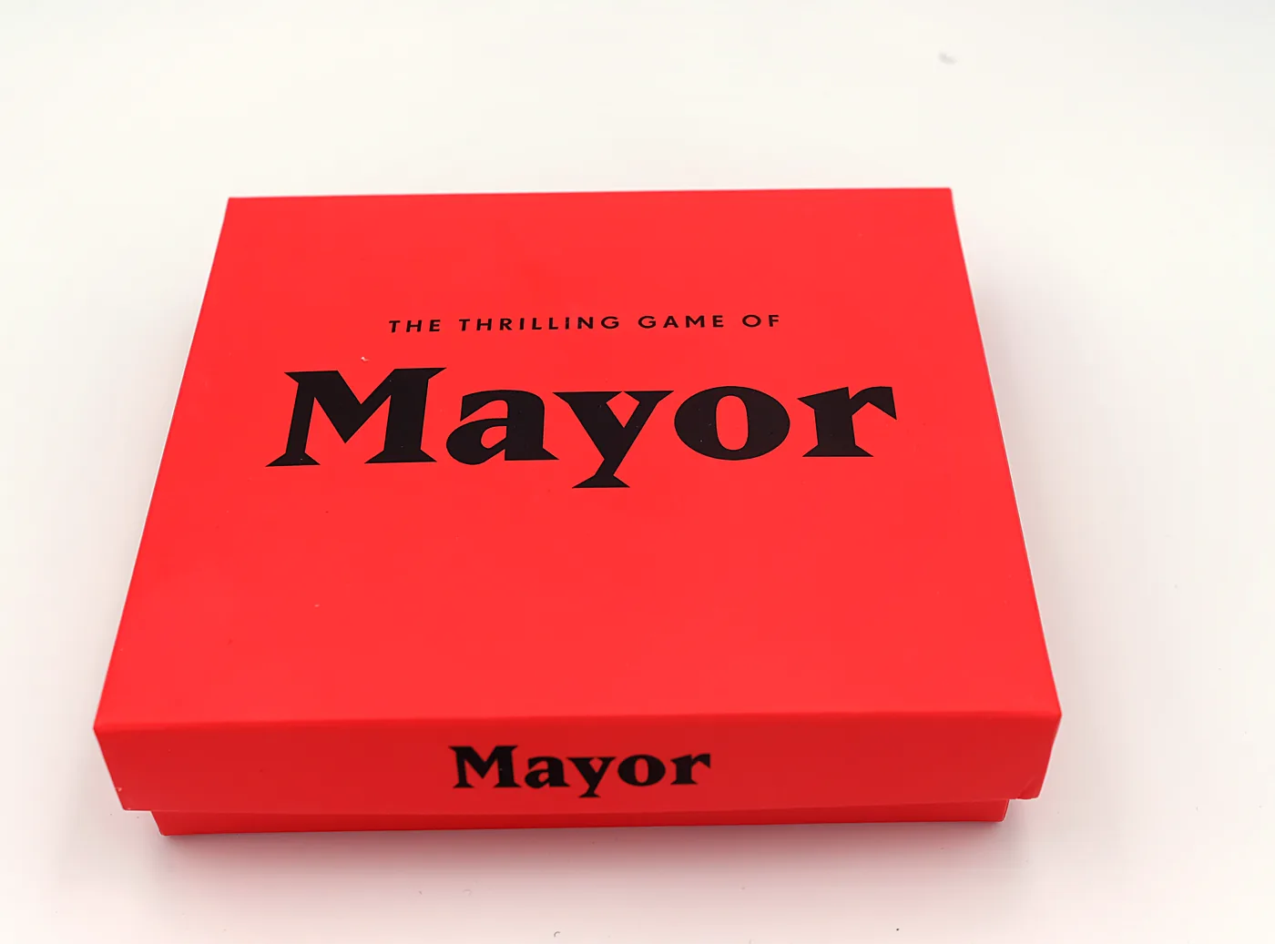The red Mayor card game box, “The Thrilling Game of Mayor”